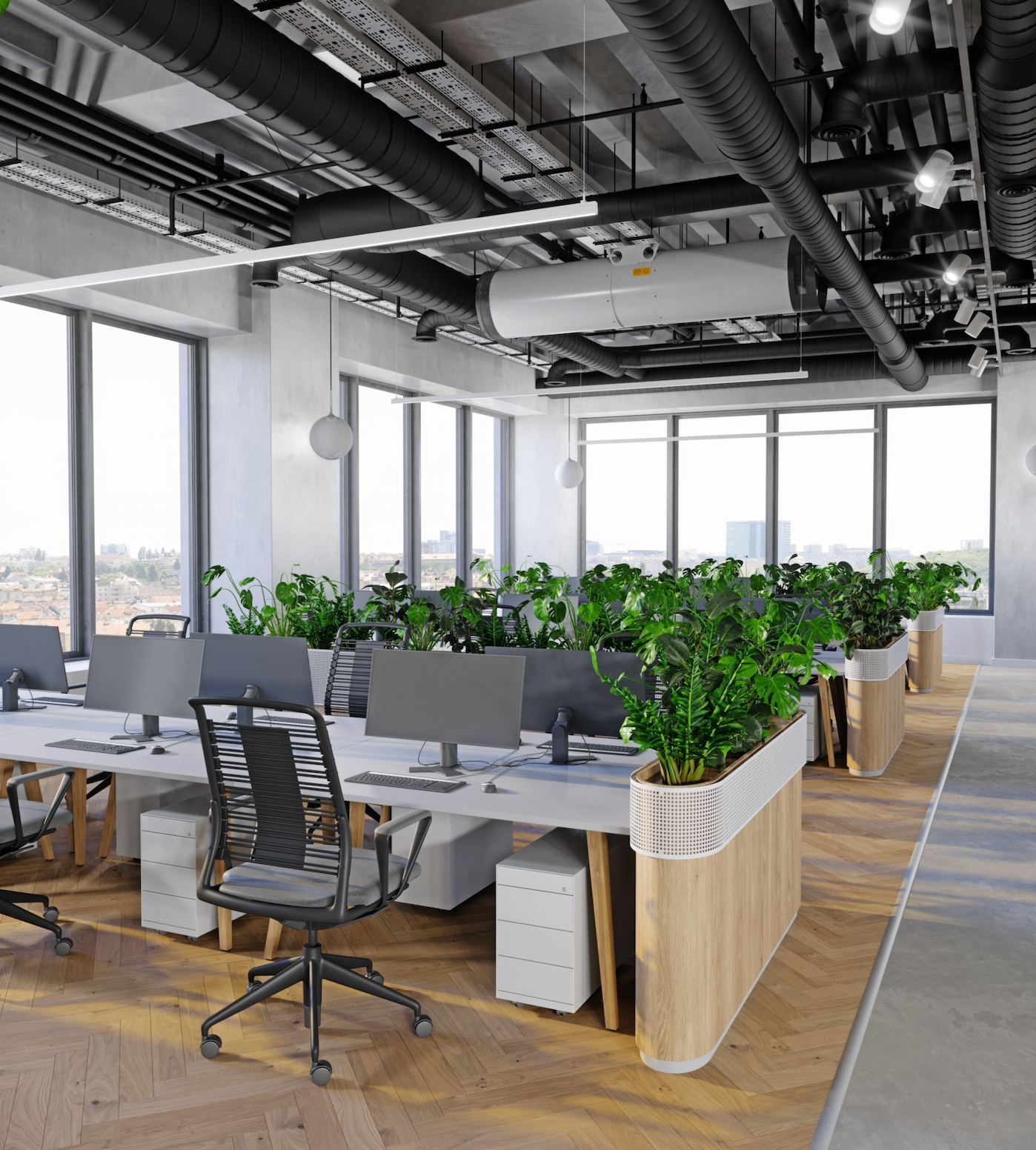 Oficina abierta con estaciones de trabajo y vegetación
